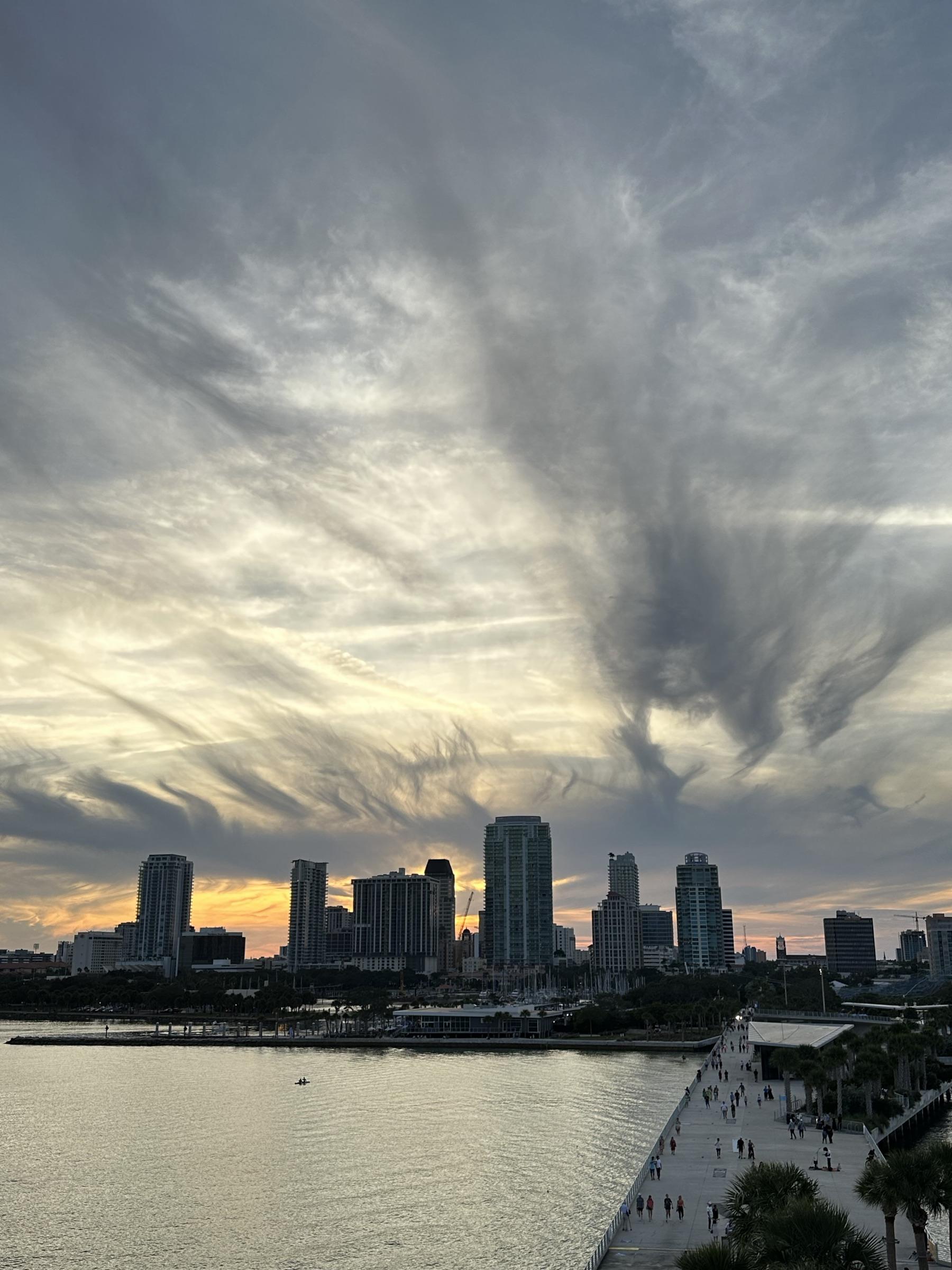 St Petersburg skyline at sunset under brushstroke clouds.